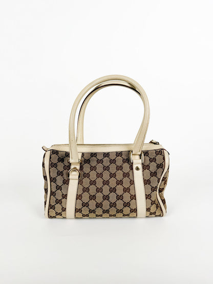 Designer handbag with gucci monogram pattern 